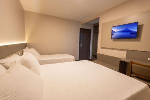 Safa Hotel Foz客房内的一张或多张床位