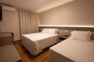 Safa Hotel Foz客房内的一张或多张床位