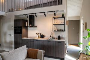 a kitchen with a sink and a counter top at B&B De Groene Driehoek 'A' in Sint Agatha