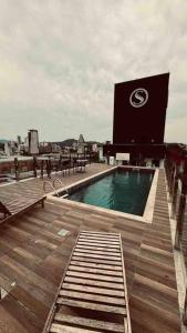 a swimming pool on the roof of a building at Loft de Luxo na Vila Germânica in Blumenau