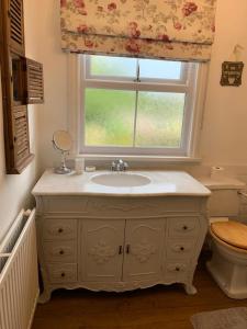 Ванная комната в Knutsford Cottage