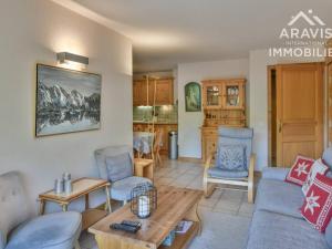 a living room with a couch and chairs and a table at Appartement Le Grand-Bornand, 4 pièces, 6 personnes - FR-1-391-144 in Le Grand-Bornand