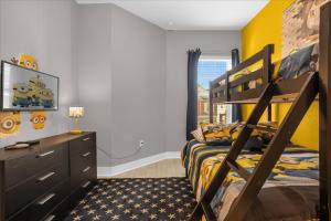 a bedroom with a bunk bed and a dresser at Magical Vacation Home 3 min from Disney in Orlando