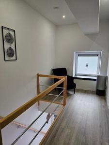 Ein Bett oder Betten in einem Zimmer der Unterkunft Appart'Hôtel Trazegnies