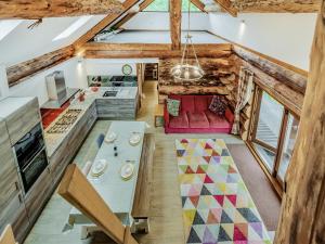 an overhead view of a living room and kitchen in a cabin at Hollacombe Lodge in Colebrooke