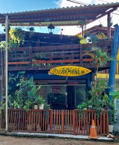 a restaurant with a sign on the front of it at Pousada Maravilha Itacaré in Itacaré