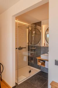 a bathroom with a shower and a sink at Aparthotel Parsberg GreenDesign in Parsberg