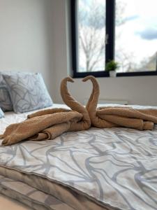 A bed or beds in a room at Mikuloff
