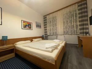 Postel nebo postele na pokoji v ubytování Krügers Hotel