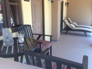 a room with chairs and a table and a door at Andreas Hotel & Spa in Palm Springs