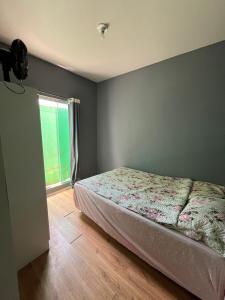 Giường trong phòng chung tại Quarto Suíte Hostel