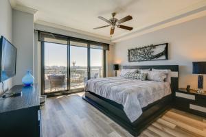 a bedroom with a bed and a ceiling fan at Emerald Grande Condo Beach, Marina and Ocean View in Destin +22 photos