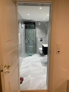 a bathroom being remodeled with a shower and a toilet at Beautiful 2 rooms apartment in kløfta in Klofta