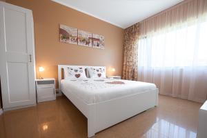 Postel nebo postele na pokoji v ubytování Apartament Alexandru Neptun Private Suites