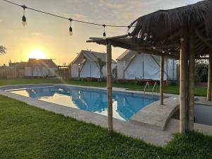 a swimming pool in a yard with a tent at AMAY in Asia