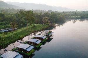 an aerial view of a river with many houses at Phu Naphat Resort in Tha Kradan