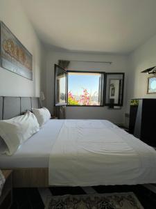 Un pat sau paturi într-o cameră la Appartement maria marina