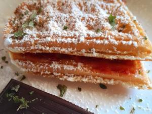 a sandwich is cut in half on a plate at La Stella in Civita