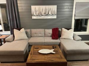 a living room with a couch and a table at Riverside Retreat in Benton Harbor