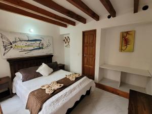 Postel nebo postele na pokoji v ubytování Casa Cantabria Hotel