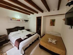 Postel nebo postele na pokoji v ubytování Casa Cantabria Hotel