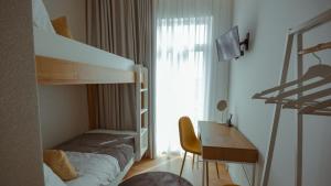 Postel nebo postele na pokoji v ubytování Pedra de Sal - Hostel & Suites