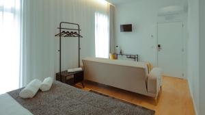 Postel nebo postele na pokoji v ubytování Pedra de Sal - Hostel & Suites