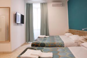 A bed or beds in a room at Roma Trasteverina