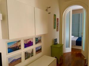 a living room with pictures on the wall at BellAria Bliss Relax a 10 Minuti dal Cuore di Bologna con parcheggio privato in Bologna
