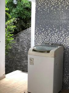 a bathroom with a shower with a toilet on top at casa de Luciana - Lençóis in Lençóis
