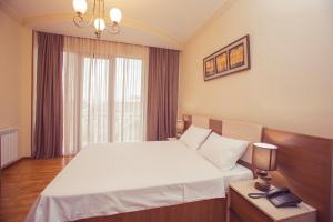Postel nebo postele na pokoji v ubytování Royal Venezia Hotel