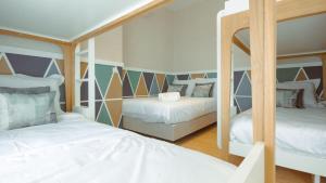 Postel nebo postele na pokoji v ubytování Pedra de Sal - Hostel & Suites