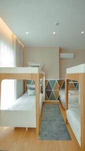 Postel nebo postele na pokoji v ubytování Pedra de Sal - Hostel & Suites