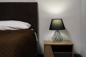Een bed of bedden in een kamer bij KOLSAY HOME