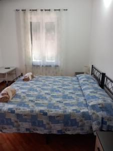 Postel nebo postele na pokoji v ubytování Agriturismo U muinettu