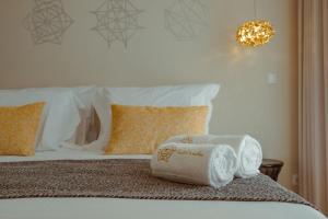 Postel nebo postele na pokoji v ubytování Pedra de Sal - Hostel & Suites