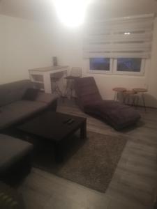 a living room with a couch and a table at Apartman Ivana in Užice