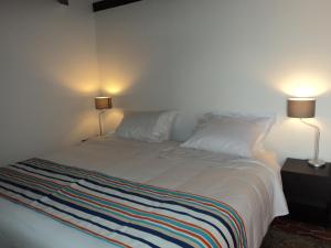 Cama o camas de una habitación en Hotel Acuarela