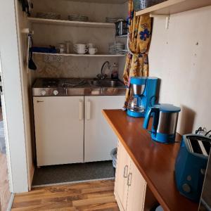 a small kitchen with a counter and a sink at Wilhelm Busch Stube in Ebergötzen +40 photos