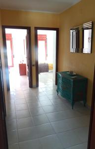a room with a green dresser and a room with doors at Ebro Escape Luxury Apartment in Móra d'Ebre +13 photos
