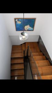 a staircase with a light hanging from a ceiling at MEDITERRÀNIA RURAL in Cabanes
