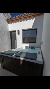 a bathroom with a sink and a mirror at MEDITERRÀNIA RURAL in Cabanes
