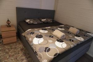 a bed with two pillows on it in a bedroom at Your home away from home! in Rovaniemi