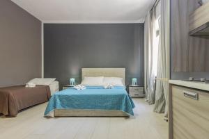 A bed or beds in a room at Moca Rooms Vento