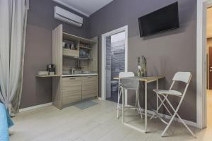 A kitchen or kitchenette at Moca Rooms Vento