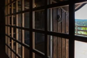 a view from a door through a window at La Kasona del mirador in Córdoba +48 photos