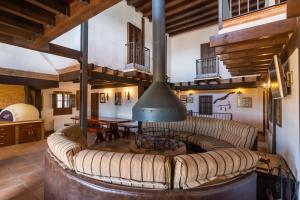 a living room with a couch and a fireplace at La Kasona del mirador in Córdoba