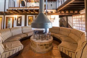 a large living room with couches and a table at La Kasona del mirador in Córdoba