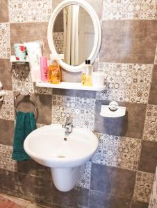 a bathroom with a sink and a mirror at Maria in Sidi Bou Saïd +20 photos