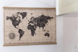 a map of the world hanging on a wall at Magnifique studio la villette avec parking in Aubervilliers